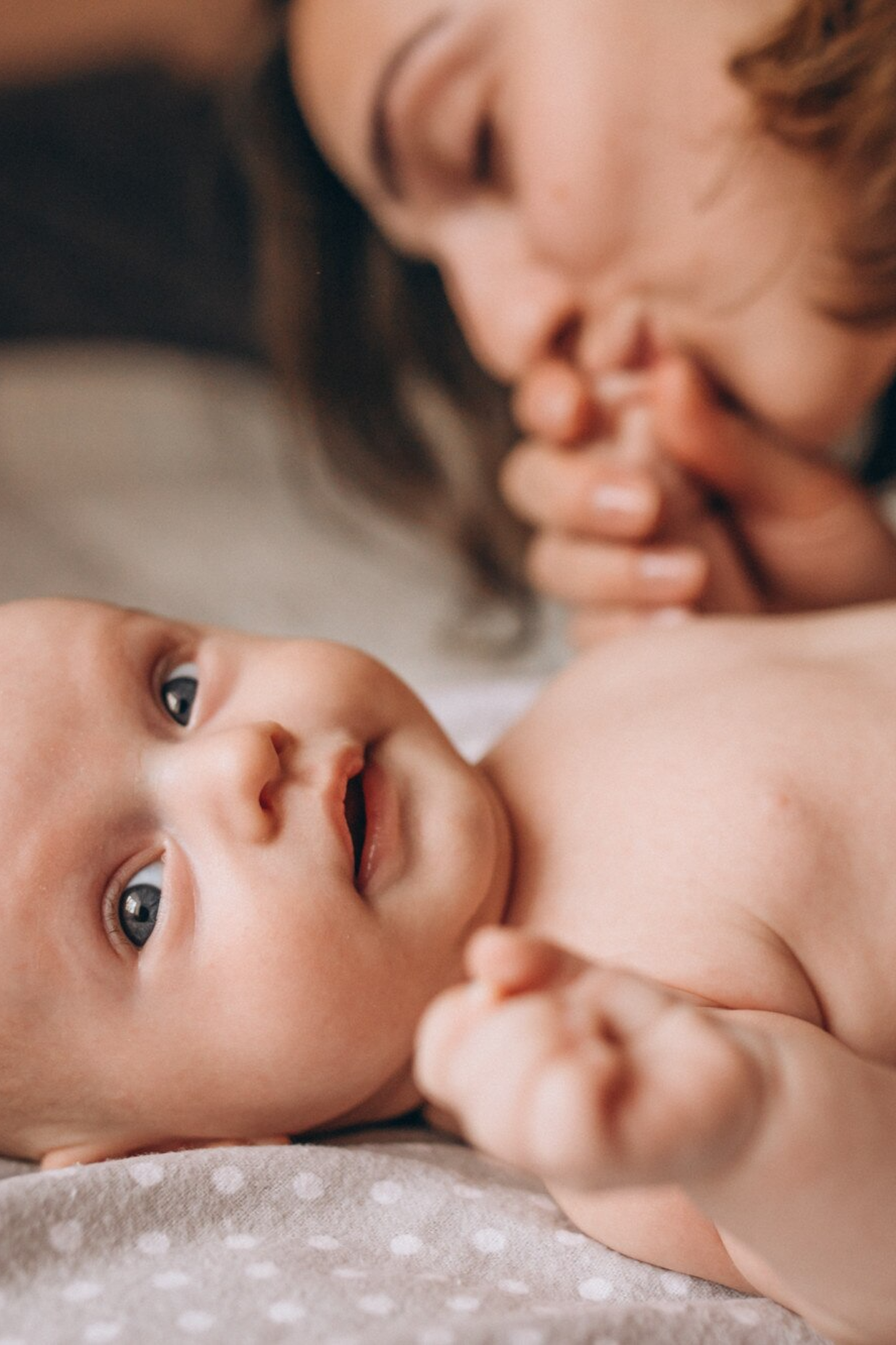 Parents lovingly looking at a newborn baby