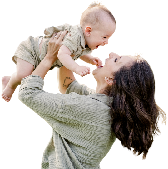 Parent holding baby with warm, supportive expression